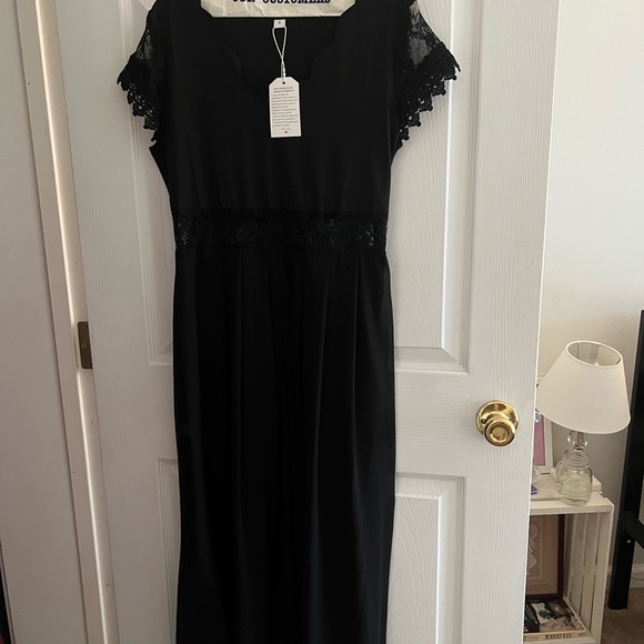 Black dress. new. size small. The waist has a see through pattern. - Picture 1 of 3
